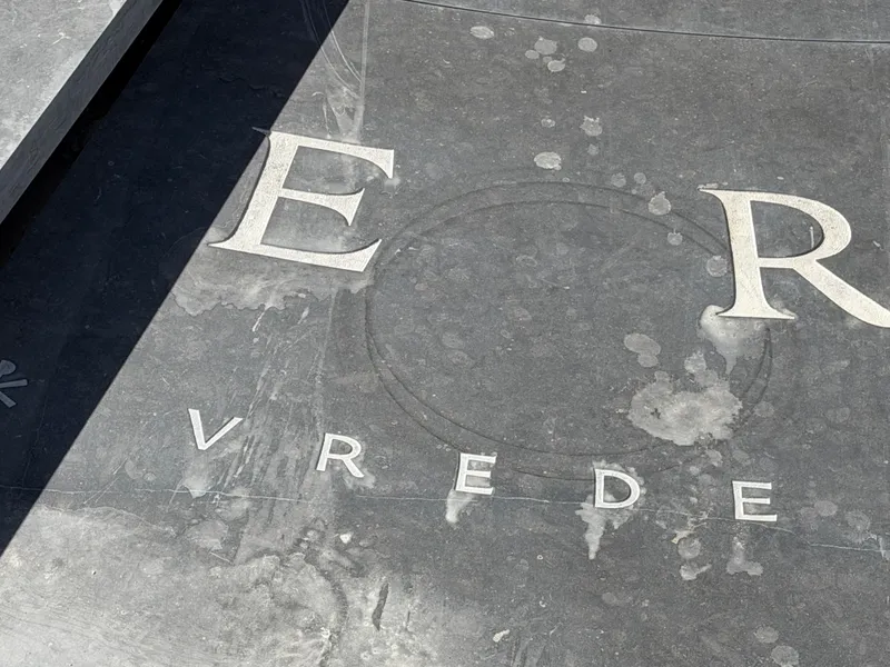 Photo of the tiles, under construction. Tools are visible.